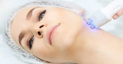 Microcurrent facial dermatology procedure. Model. Aesthetic radiofrequency treatment. Micro current cosmetology massage Radio Frequency Skin Tightening